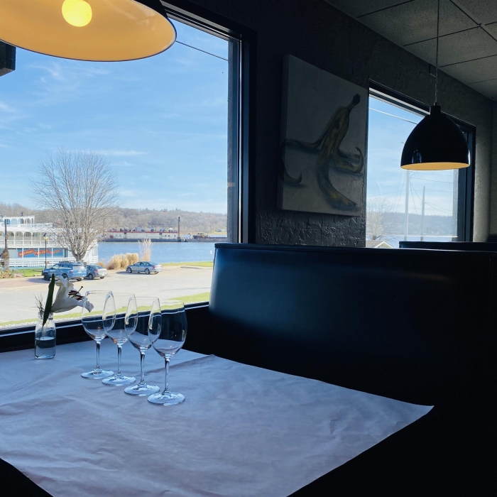 seating with view of the mississippi river in the turnkey restaurant dining room