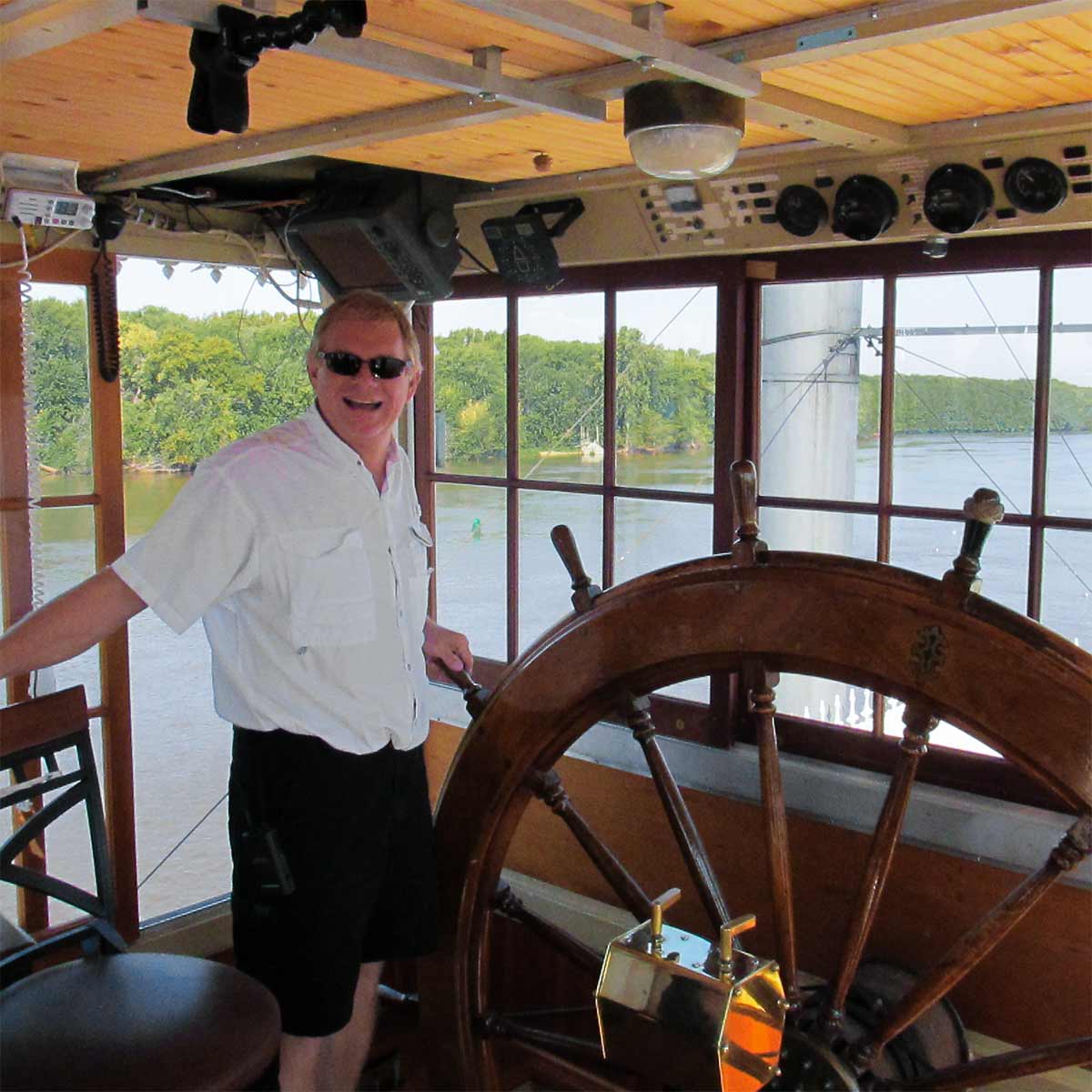 Captain Kevin at the steering wheel of the riverboat