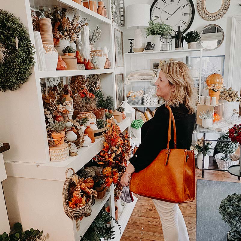 woman shopping in a gift shop in Leclaire, IA