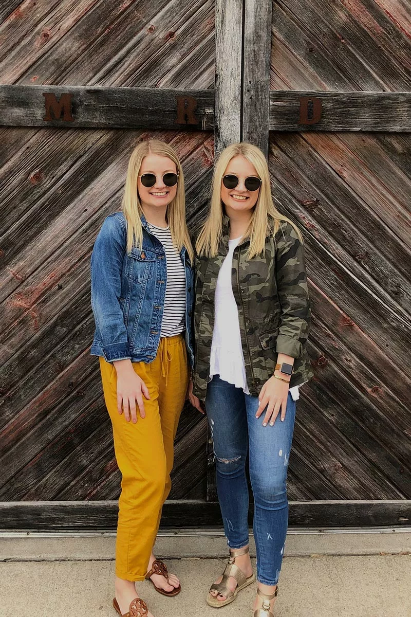 two women posing for a picture on a girls trip to LeClaire, IA