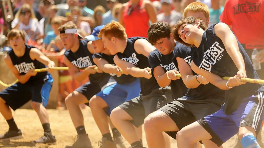 teenagers playing tug of war