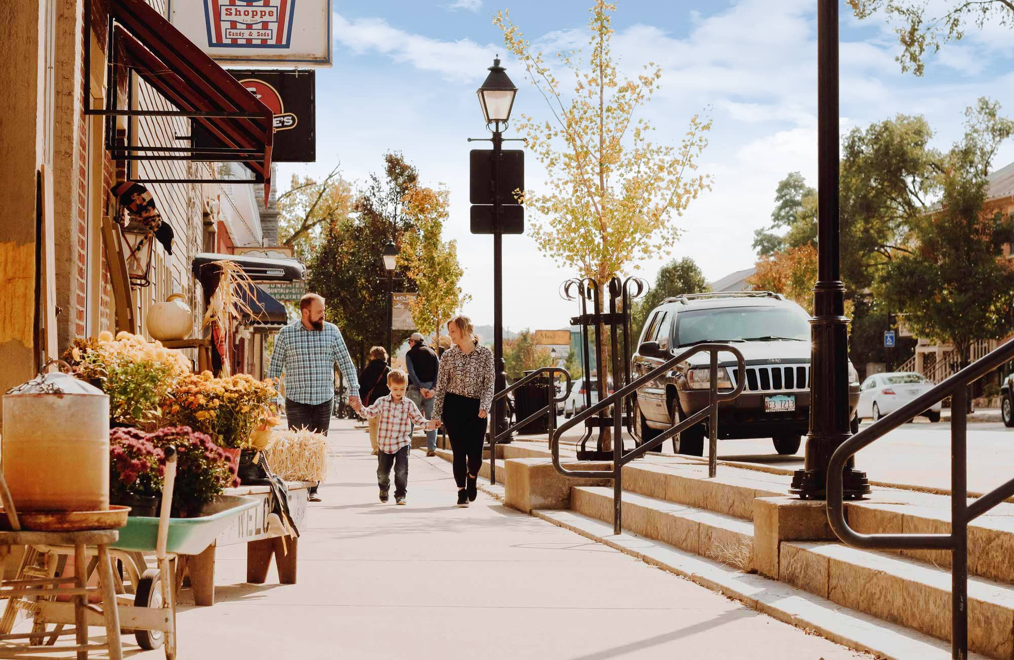 A family walking down Cody Road in fall.